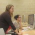 Building sub Alise Stawicki works with the yearbook staff after school. Photo by Kate Opre.